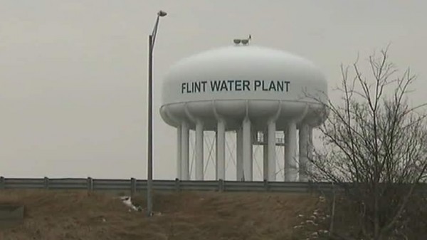Image: Four more officials charged in Flint water crisis