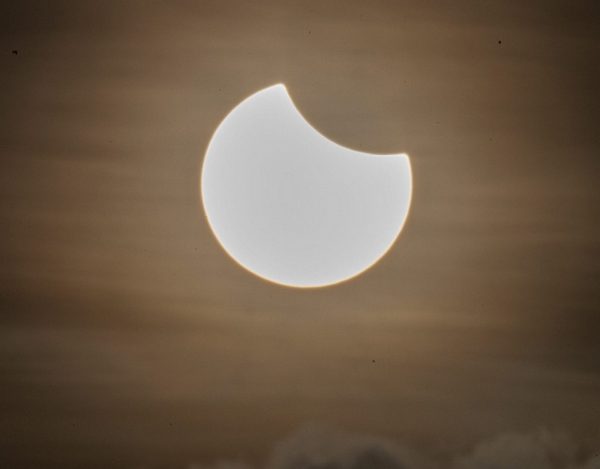 Image: They said to wear the glasses: Woman who stared at the eclipse now has a crescent-shaped burn on her retina, permanently blocking her vision