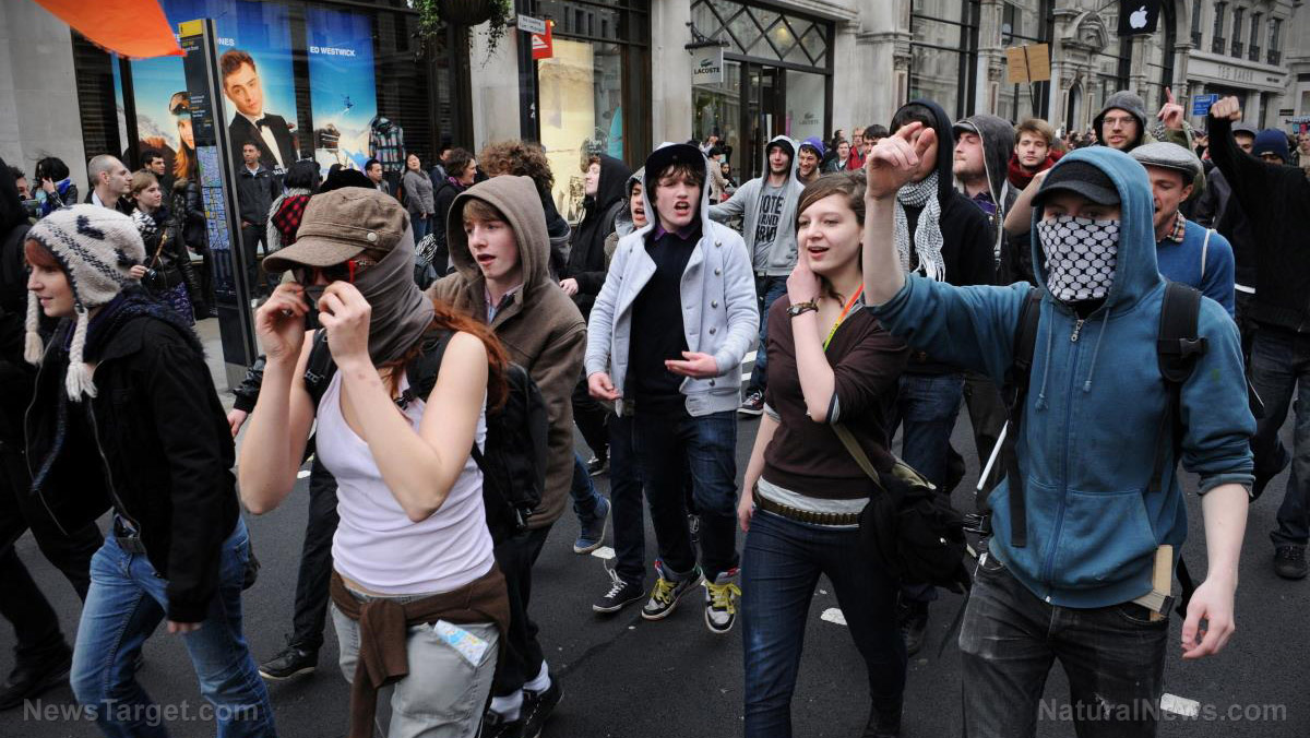 Image: TYRANNY: British riot police storm anti-lockdown protest to detain conspiracy theorist David Icke